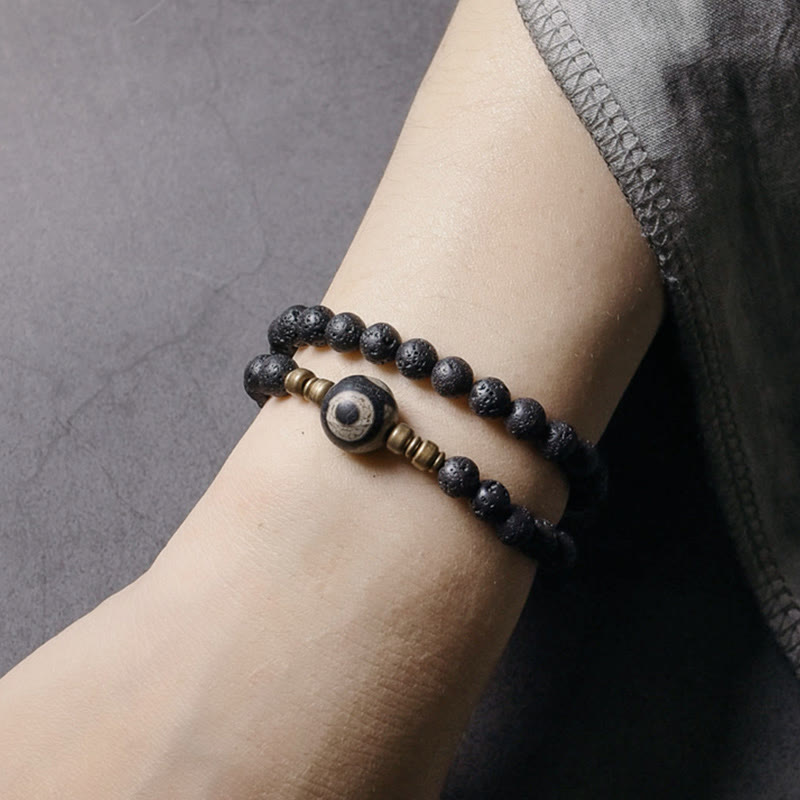 Pulsera curativa de doble vuelta con cuentas de latón y cobre de tres ojos de piedra de lava vintage de Buddha Stones