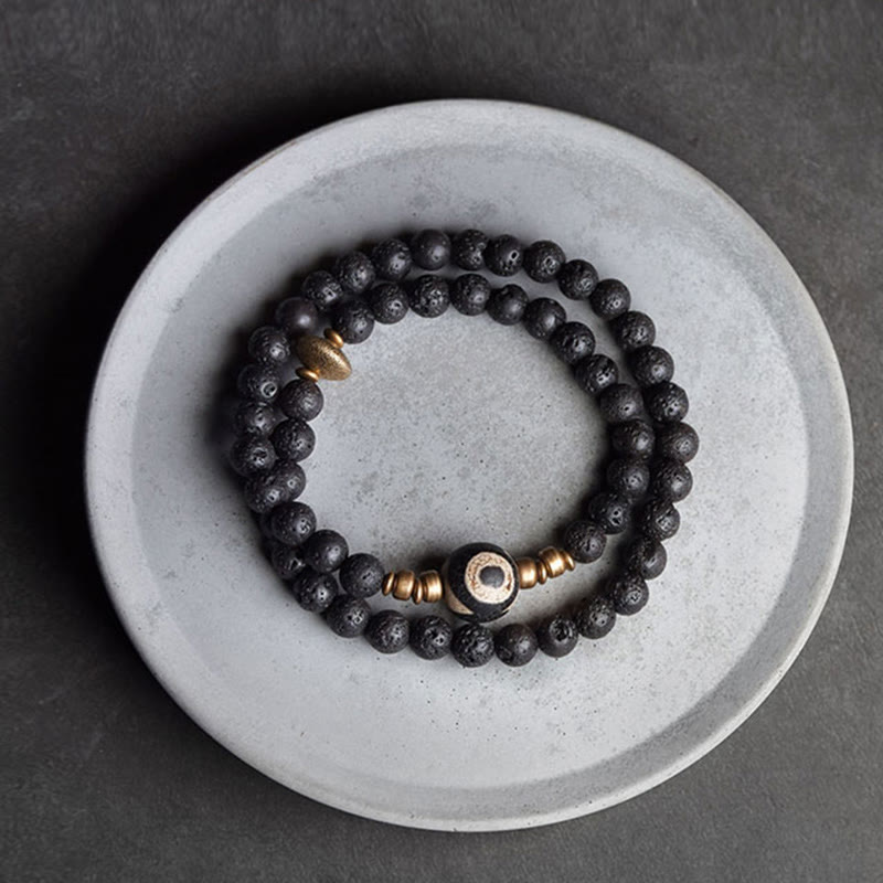 Pulsera curativa de doble vuelta con cuentas de latón y cobre de tres ojos de piedra de lava vintage de Buddha Stones