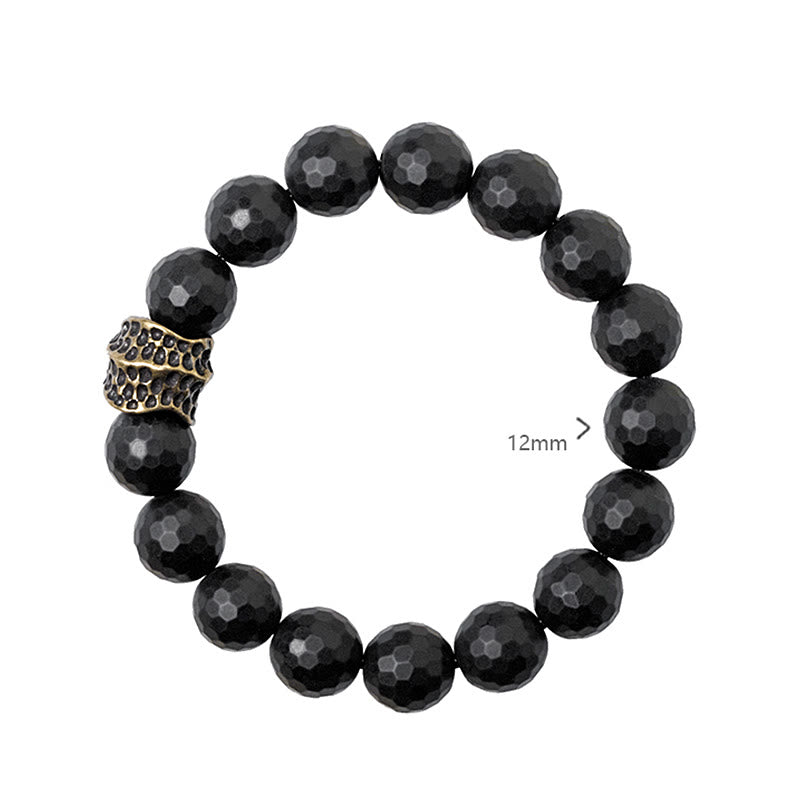 Pulsera protectora de latón y cobre con ónix negro mate y Buddha Stones