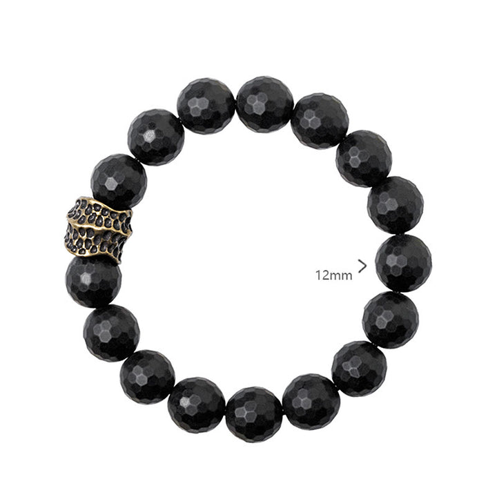 Pulsera protectora de latón y cobre con ónix negro mate y Buddha Stones