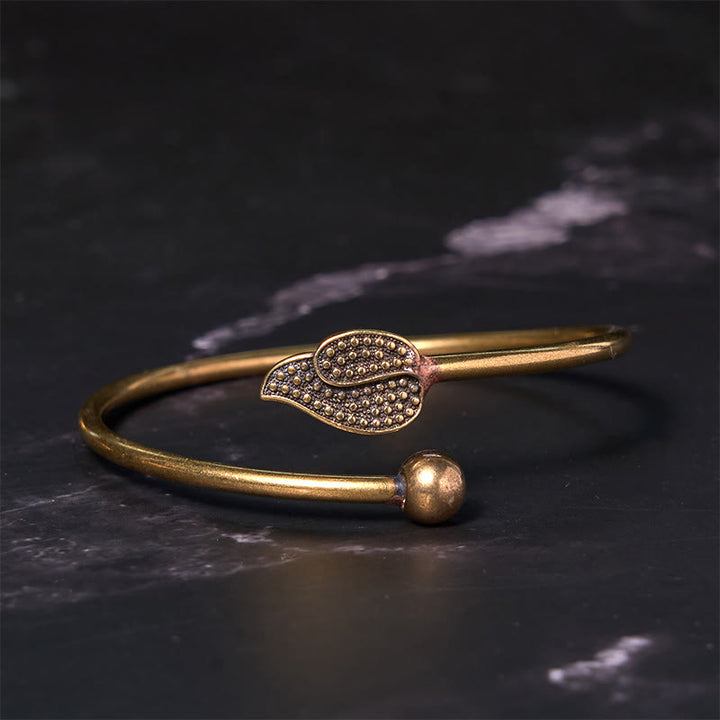 Brazalete de cobre y latón con cuentas de hojas y Buddha Stones para la suerte y la riqueza