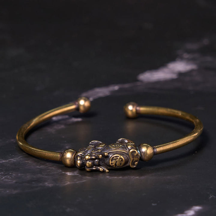 Pulsera de cobre y latón con Buddha Stones Pi Xiu y brújula que lleva el personaje Fu