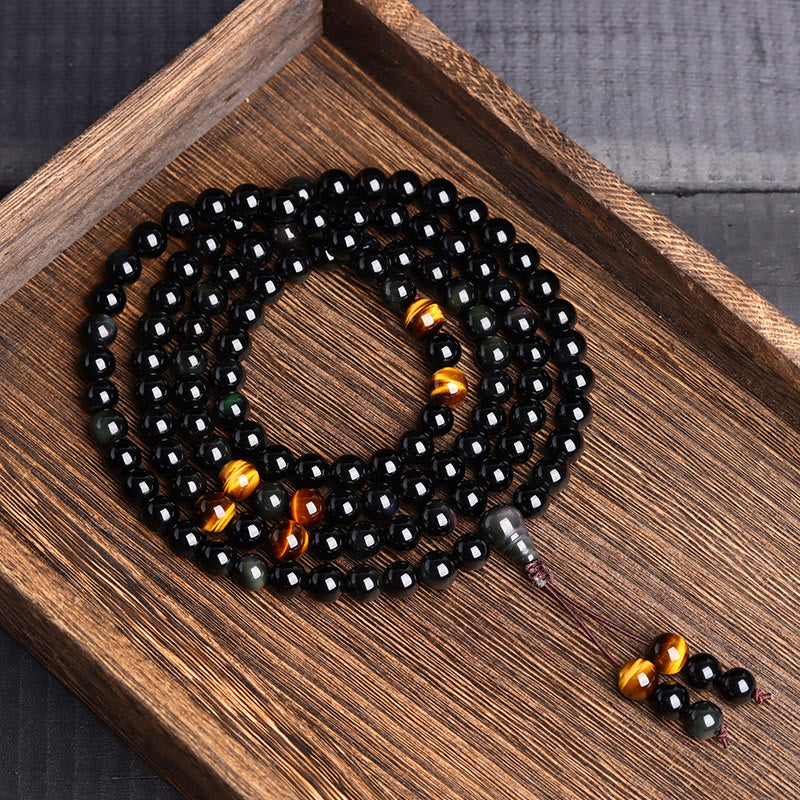 Pulsera de obsidiana negra con 108 cuentas de mala y Buddha Stones