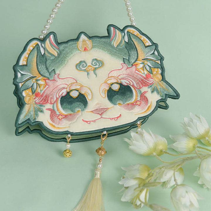 Bolso bandolera con borlas y cadena de perlas bordadas Bai Ze con bestia mítica de doble cara y Buddha Stones