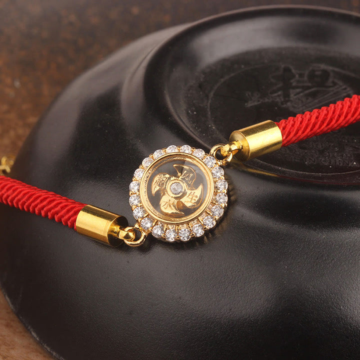 Pulsera trenzada con protección de Qi Feng Sheng Shui con molino de viento giratorio de cobre y latón con hilo rojo y Buddha Stones