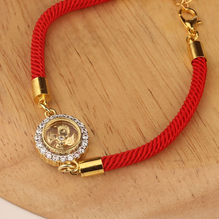 Pulsera trenzada con protección de Qi Feng Sheng Shui con molino de viento giratorio de cobre y latón con hilo rojo y Buddha Stones
