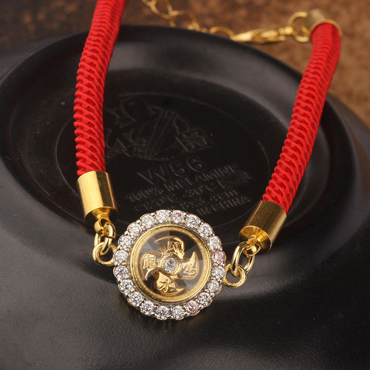 Pulsera trenzada con protección de Qi Feng Sheng Shui con molino de viento giratorio de cobre y latón con hilo rojo y Buddha Stones