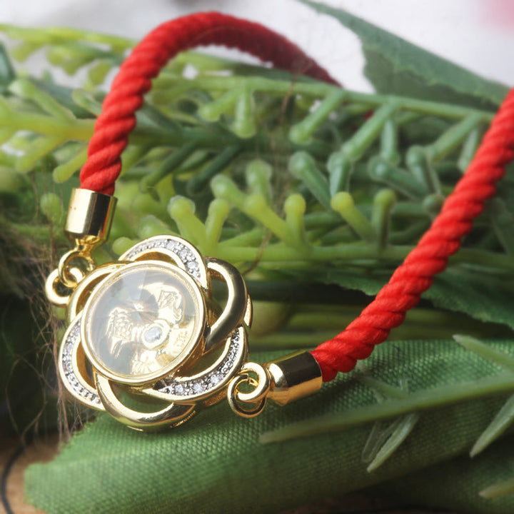 Pulsera trenzada con protección de Qi y Feng Sheng Shui con molino de viento de cobre y latón con hilo rojo ciruela giratorio y Buddha Stones