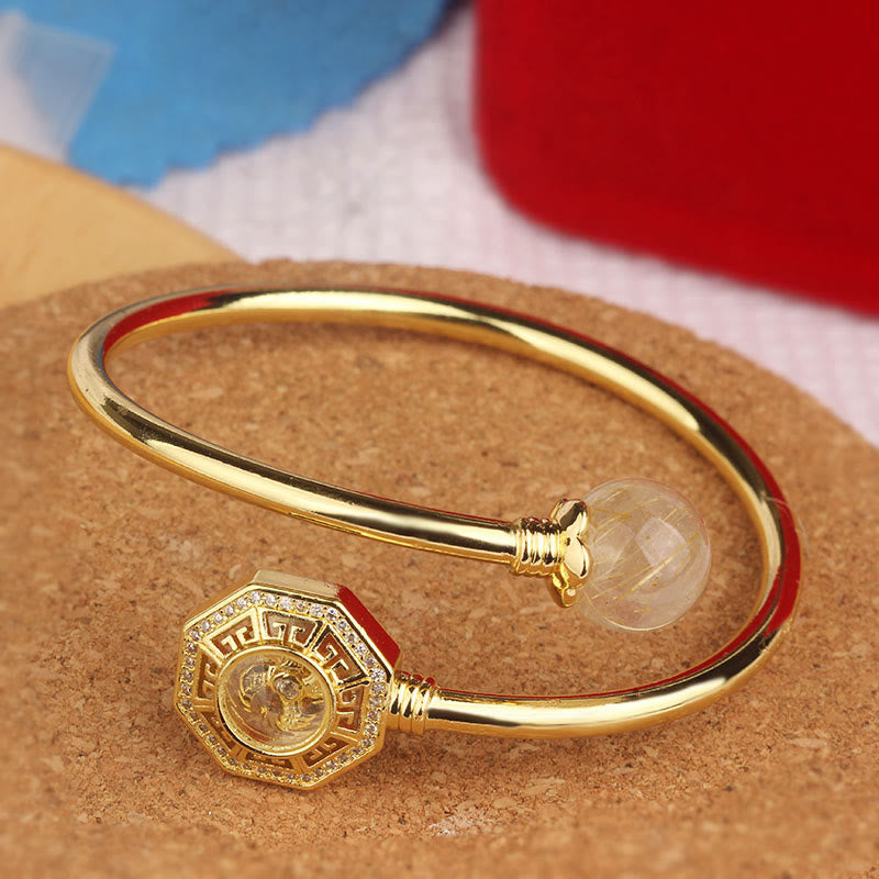 Pulsera brazalete de coraje de Feng Sheng Shui Qi con molino de viento giratorio de cobre y latón con Buddha Stones y cuarzo rutilado