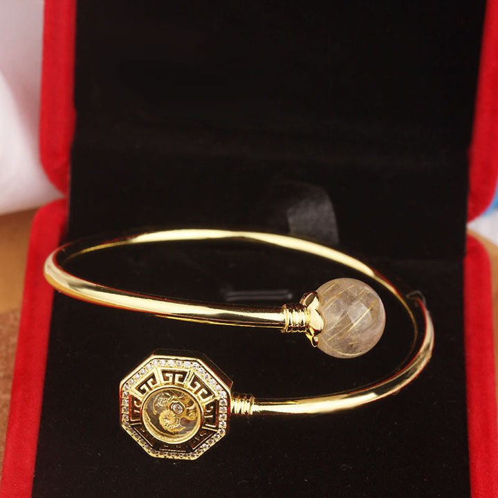 Pulsera brazalete de coraje de Feng Sheng Shui Qi con molino de viento giratorio de cobre y latón con Buddha Stones y cuarzo rutilado