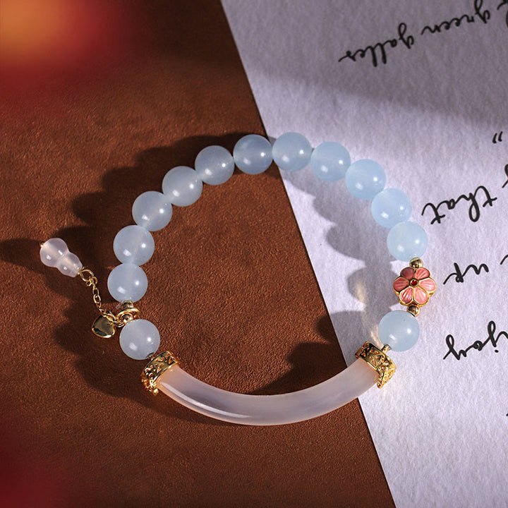 Brazalete tipo brazalete con Buddha Stones, cristal rosa, calcedonia azul y perla