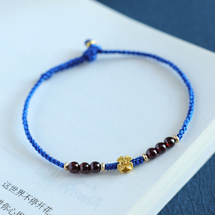 Pulsera Flower Power de cobre, granate, ágata roja del sur y hilo azul Klein de Buddha Stones