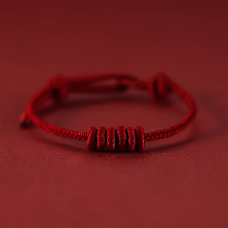 Pulsera de fuerza de ocho hilos con hilo rojo y Buddha Stones