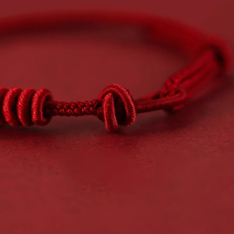 Pulsera de fuerza de ocho hilos con hilo rojo y Buddha Stones