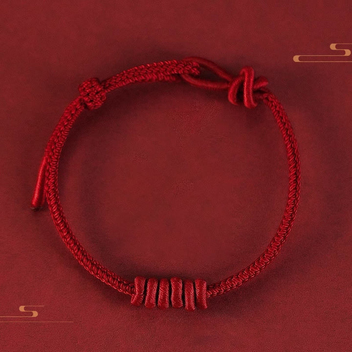 Pulsera de fuerza de ocho hilos con hilo rojo y Buddha Stones