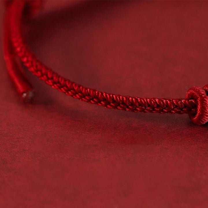 Pulsera de fuerza de ocho hilos con hilo rojo y Buddha Stones
