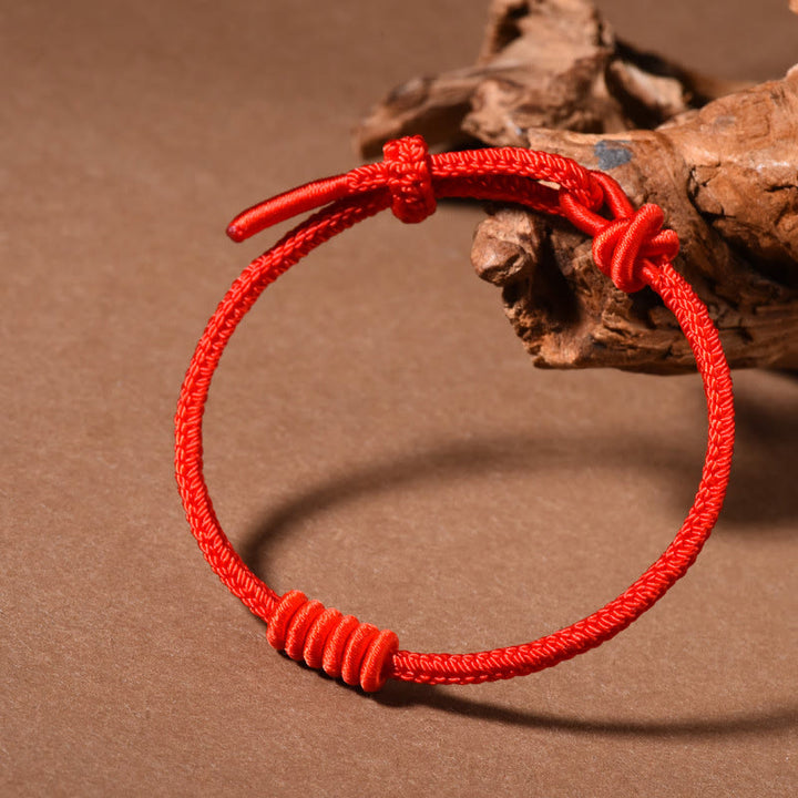 Pulsera de fuerza de ocho hilos con hilo rojo y Buddha Stones