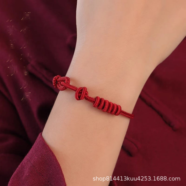 Pulsera de fuerza de ocho hilos con hilo rojo y Buddha Stones