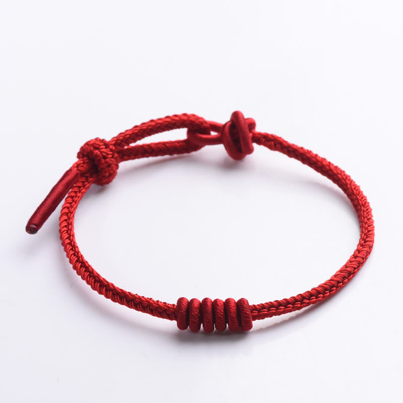 Pulsera de fuerza de ocho hilos con hilo rojo y Buddha Stones