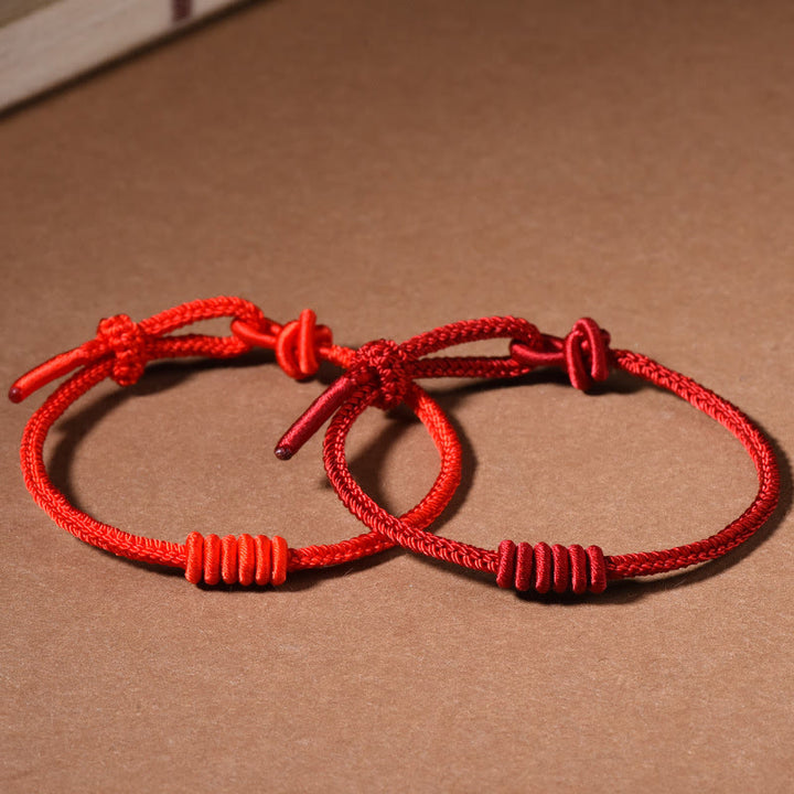Pulsera de fuerza de ocho hilos con hilo rojo y Buddha Stones
