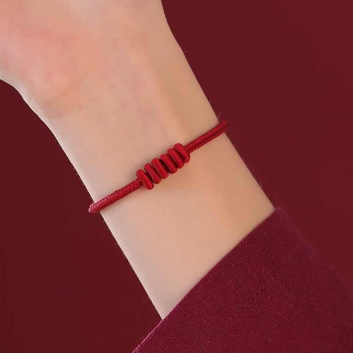 Pulsera de fuerza de ocho hilos con hilo rojo y Buddha Stones
