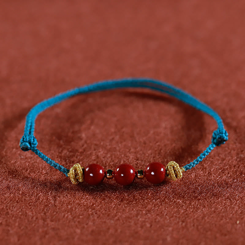 Pulsera de cinabrio con hilo colorido y Buddha Stones