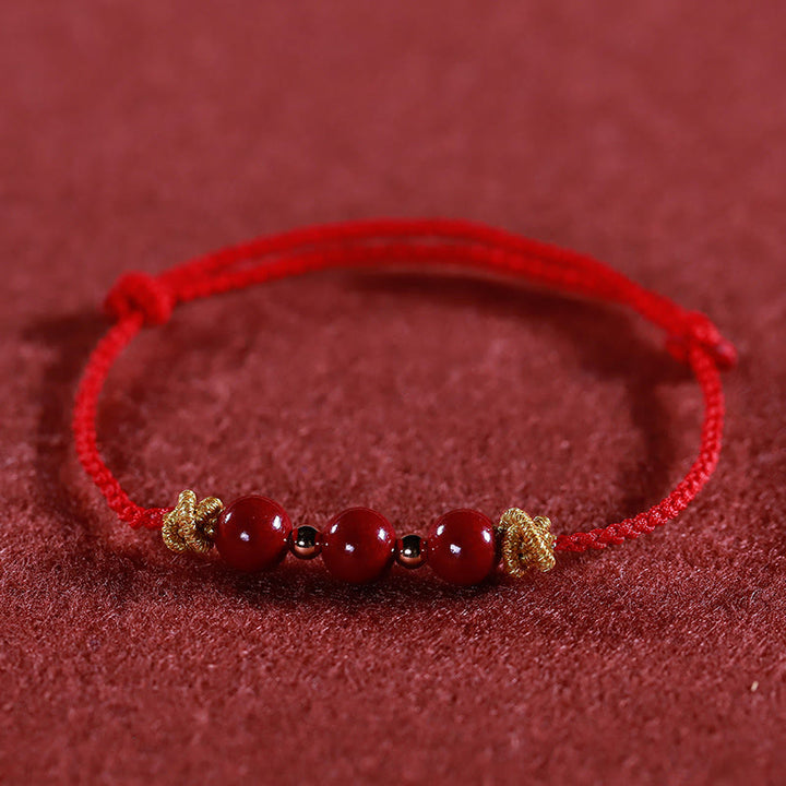 Pulsera de cinabrio con hilo colorido y Buddha Stones