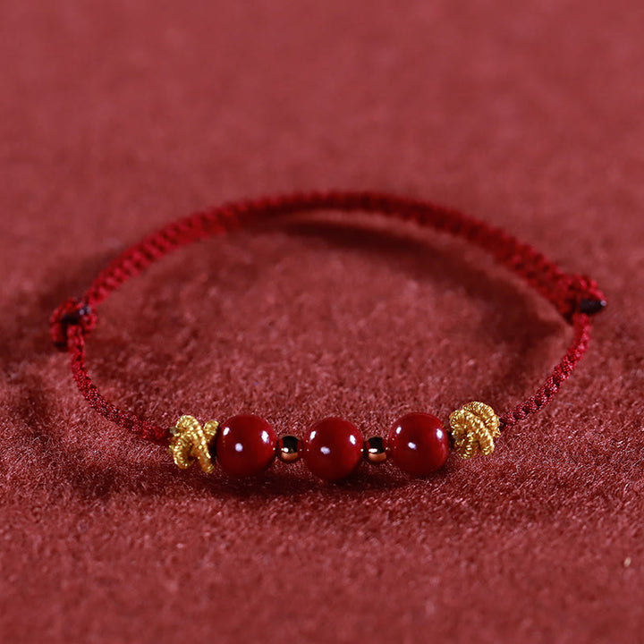 Pulsera de cinabrio con hilo colorido y Buddha Stones