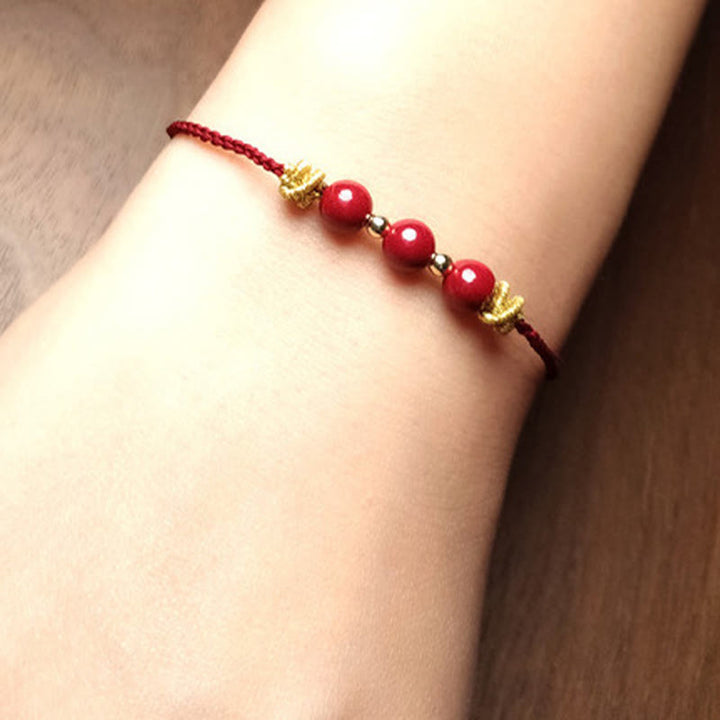 Pulsera de cinabrio con hilo colorido y Buddha Stones