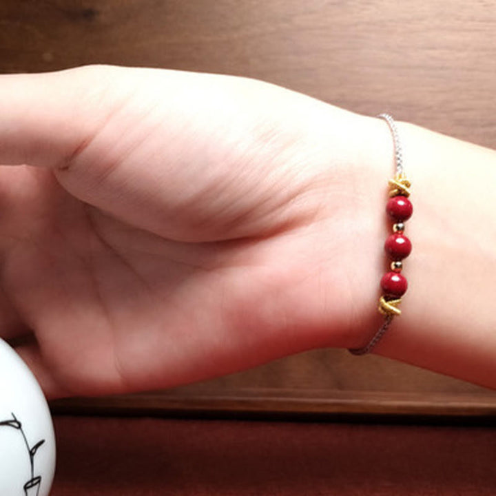 Pulsera de cinabrio con hilo colorido y Buddha Stones