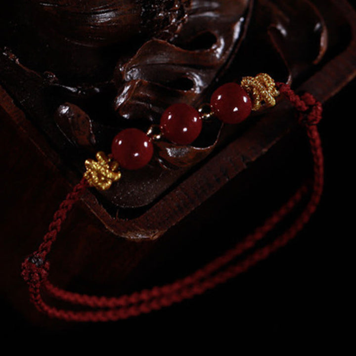Pulsera de cinabrio con hilo colorido y Buddha Stones