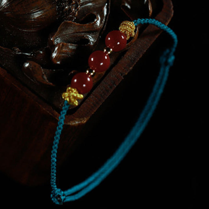 Pulsera de cinabrio con hilo colorido y Buddha Stones