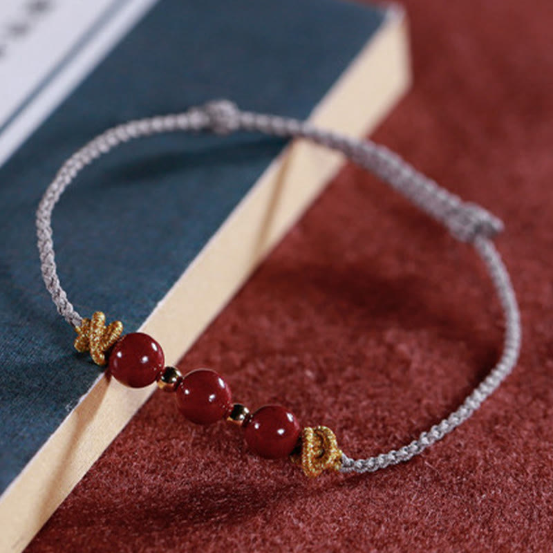 Pulsera de cinabrio con hilo colorido y Buddha Stones
