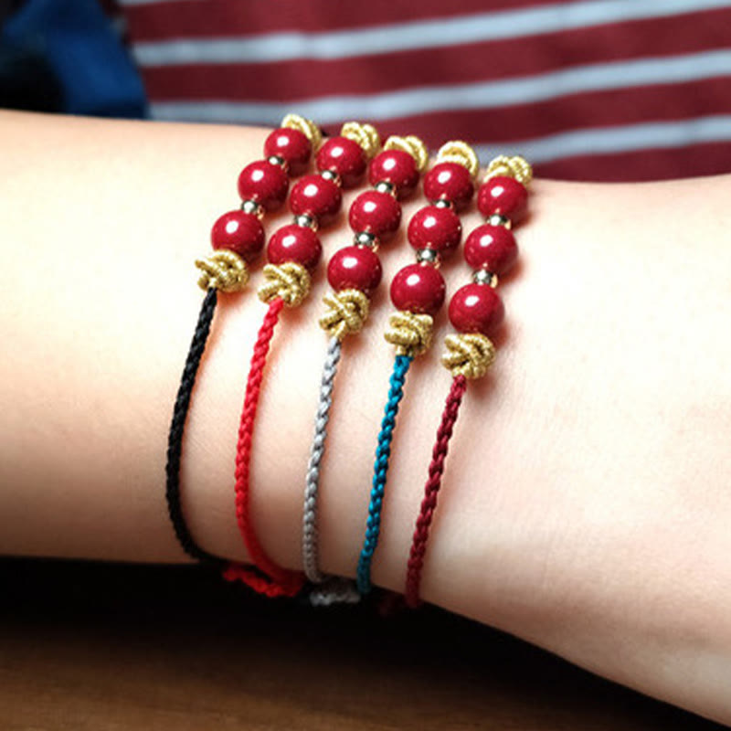 Pulsera de cinabrio con hilo colorido y Buddha Stones