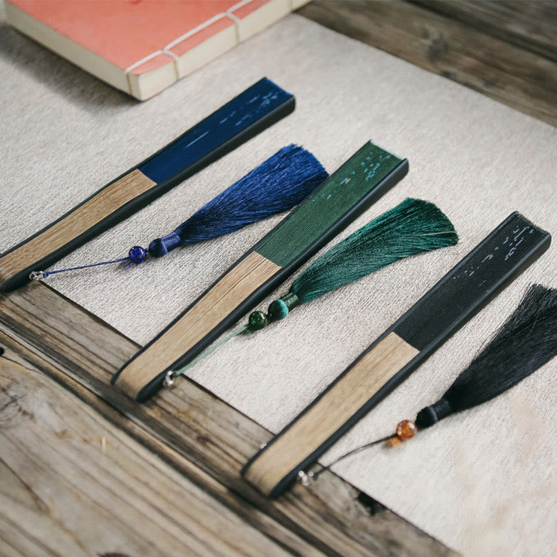 Abanico plegable de bambú con borlas y diseño de hojas de bambú y Buddha Stones