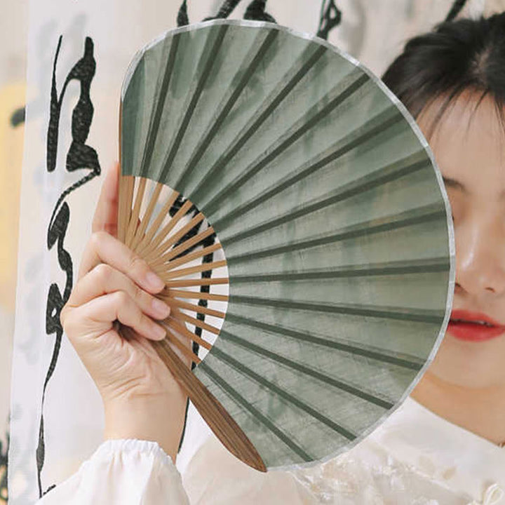 Abanico plegable de bambú de mano con forma de concha de color sólido retro con Buddha Stones