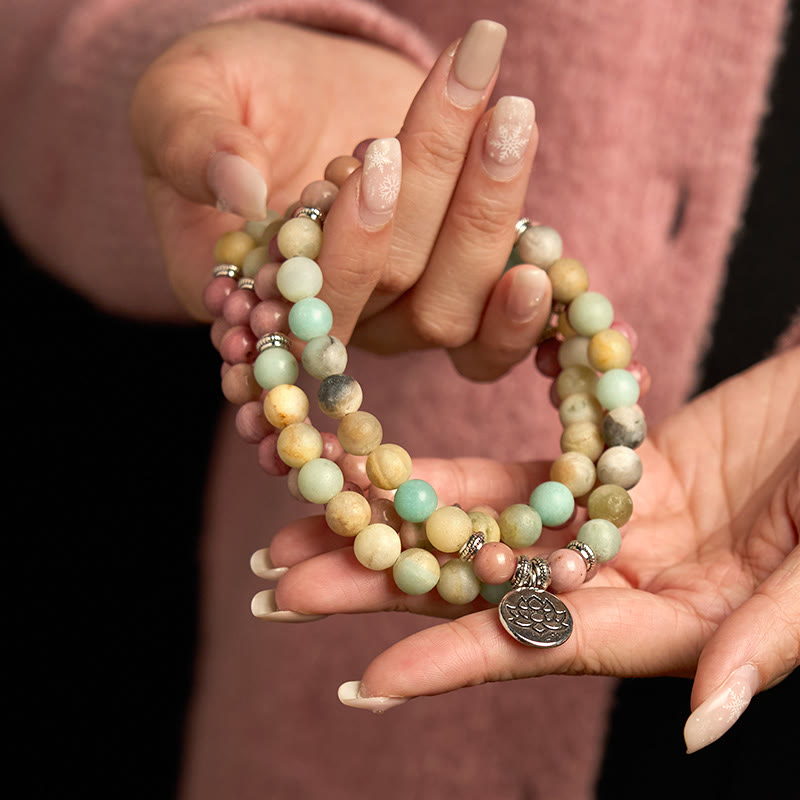 Pulsera de compasión de loto con 108 cuentas de amazonita y rodonita de Buddha Stones