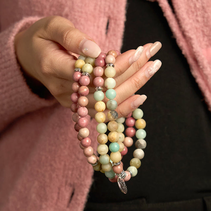 Pulsera de compasión de loto con 108 cuentas de amazonita y rodonita de Buddha Stones