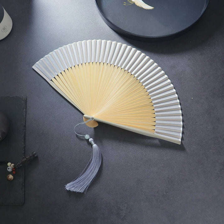 Abanico plegable de bambú con borlas de poliéster y Buddha Stones, 21 cm