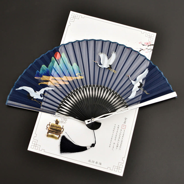 Abanico plegable de bambú con tela de lino y algodón de color liso con degradado de grullas y piedras de Buddha Stones y nubes auspiciosas