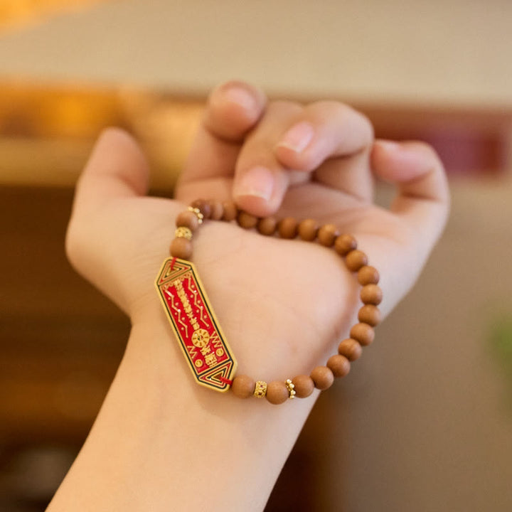 Pulsera de armonía con caracteres chinos Bagua Yin Yang de cobre bañado en oro con cuentas de madera de sándalo y Buddha Stones