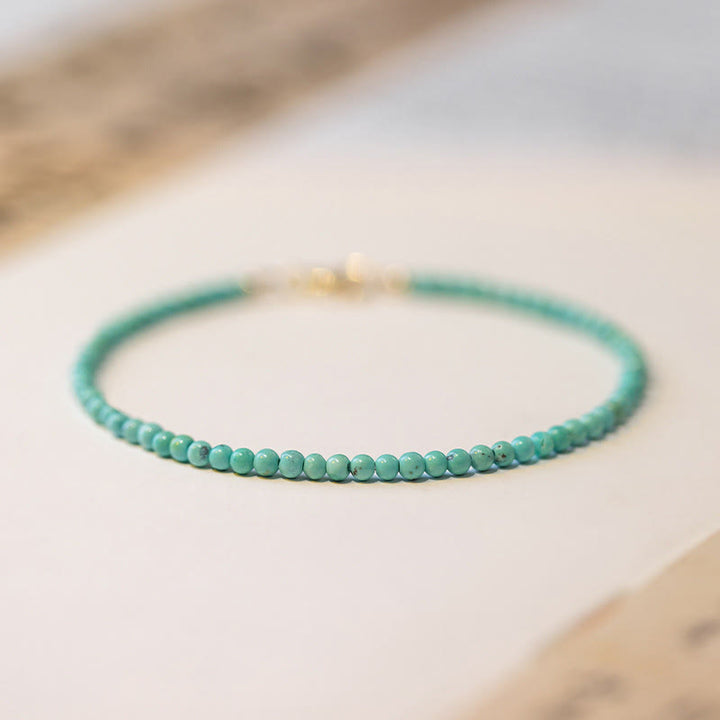 Pulsera de la sabiduría de cobre bañada en oro de 14 k con cuentas ultrafinas de turquesa de 2 mm y Buddha Stones