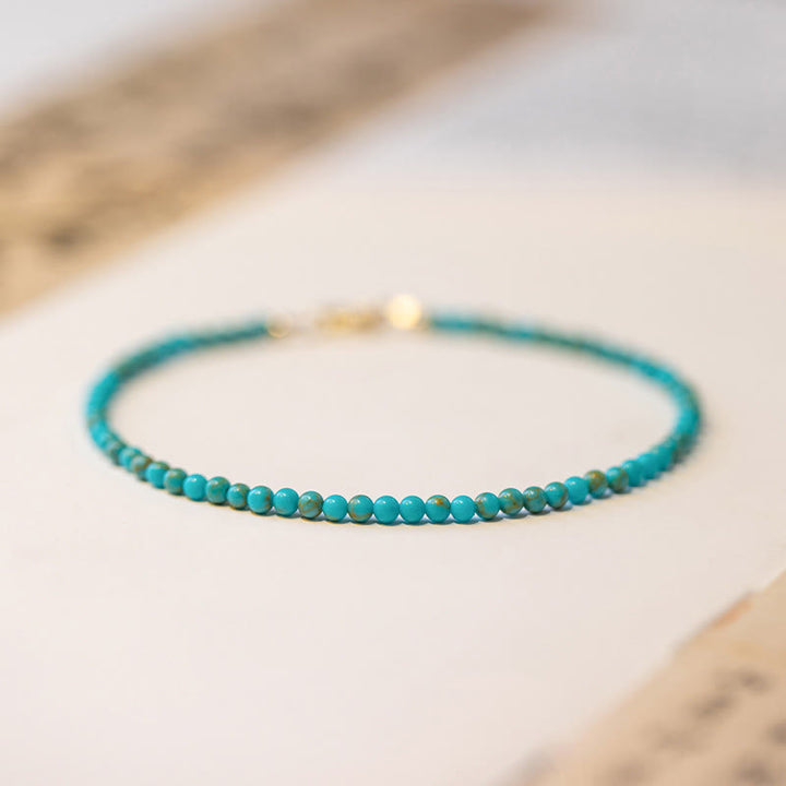 Pulsera de la sabiduría de cobre bañada en oro de 14 k con cuentas ultrafinas de turquesa de 2 mm y Buddha Stones