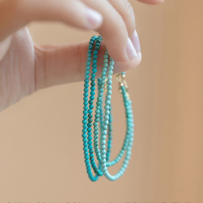 Pulsera de la sabiduría de cobre bañada en oro de 14 k con cuentas ultrafinas de turquesa de 2 mm y Buddha Stones