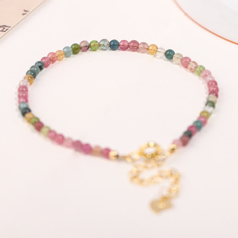 Pulsera de la sabiduría de cobre bañada en oro de 14 k con cuentas ultrafinas de turmalina multicolor de 2 mm y Buddha Stones