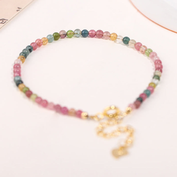 Pulsera de la sabiduría de cobre bañada en oro de 14 k con cuentas ultrafinas de turmalina multicolor de 2 mm y Buddha Stones