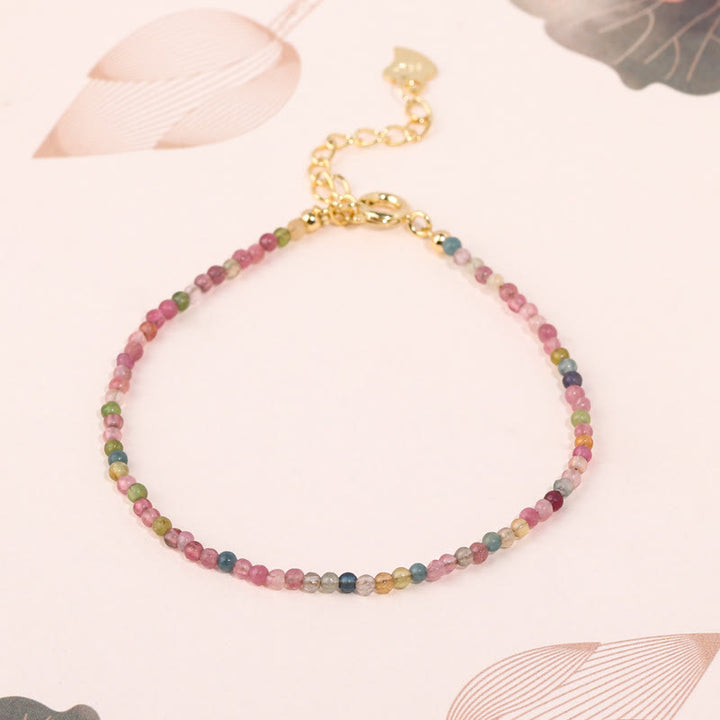 Pulsera de la sabiduría de cobre bañada en oro de 14 k con cuentas ultrafinas de turmalina multicolor de 2 mm y Buddha Stones