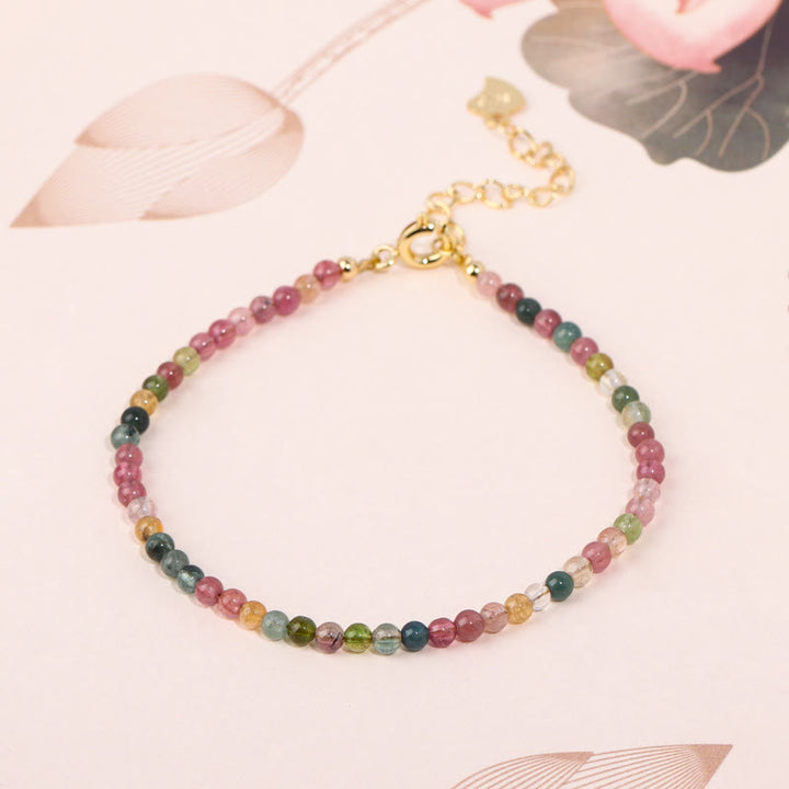 Pulsera de la sabiduría de cobre bañada en oro de 14 k con cuentas ultrafinas de turmalina multicolor de 2 mm y Buddha Stones