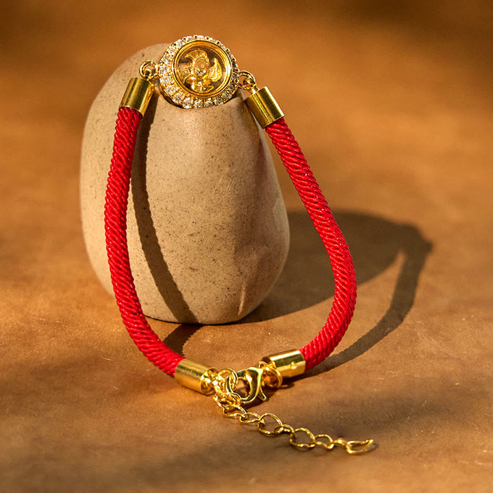 Pulsera trenzada con protección de Qi Feng Sheng Shui con molino de viento giratorio de cobre y latón con hilo rojo y Buddha Stones