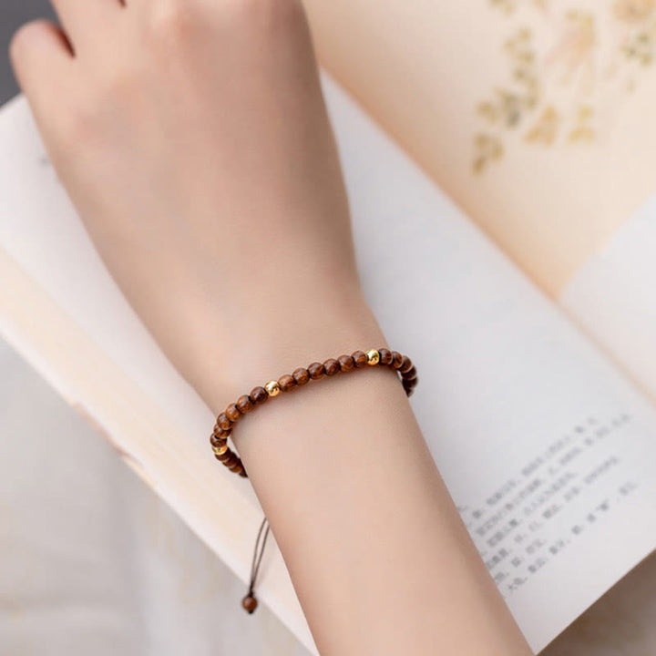 Pulsera protectora con cuentas de cobre bañadas en oro de 14 quilates y sándalo ultrafinas de 4 mm y Buddha Stones